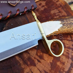 Detailed view of the Tombstone Bowie Knife's stag antler handle with brass ring guard.