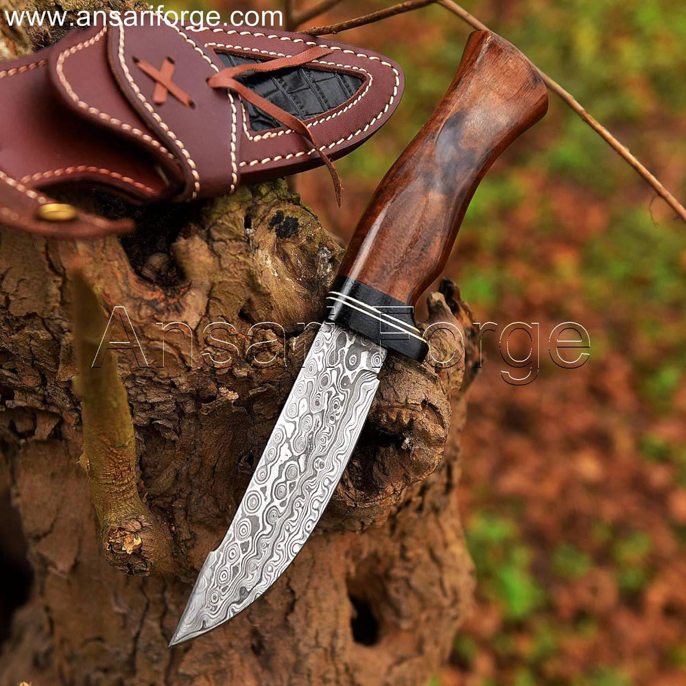 Exquisite Damascus knife with rain drop pattern, rosewood handle, and cowhide leather sheath.
