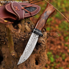 Exquisite Damascus knife with rain drop pattern, rosewood handle, and cowhide leather sheath.