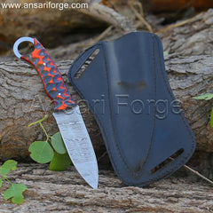 Hand-forged Damascus steel EDC fixed blade knife with Pakkawood handle, displayed in its genuine cowhide cross draw sheath.