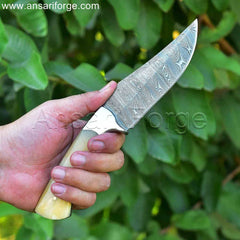 Handmade Damascus Hunting Knife with twist pattern blade, camel bone handle, and leather sheath.