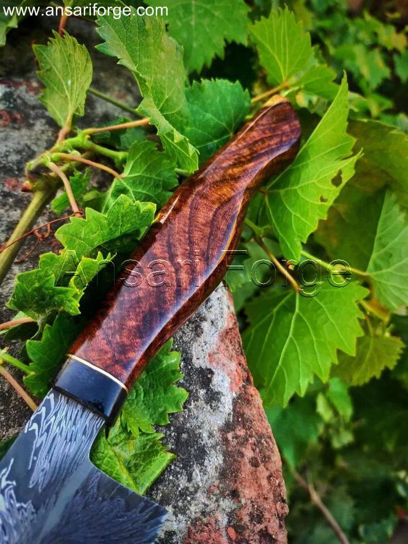 Mosaic Damascus Chef Knife nestled in its cowhide leather sheath, showcasing both for safe storage.