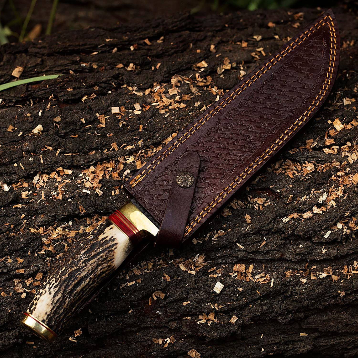 Custom forged Bowie knife with mirror-polished, 1095 high carbon steel blade and natural hammer marks. Stag antler handle and cowhide leather sheath. Overall length 12 inches.