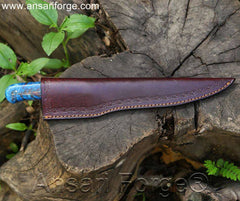 Damascus steel fish fillet knife in brown leather sheath