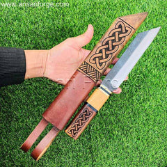 A photo of someone holding the Beagnoth Viking Seax Knife, showcasing its size and weight.