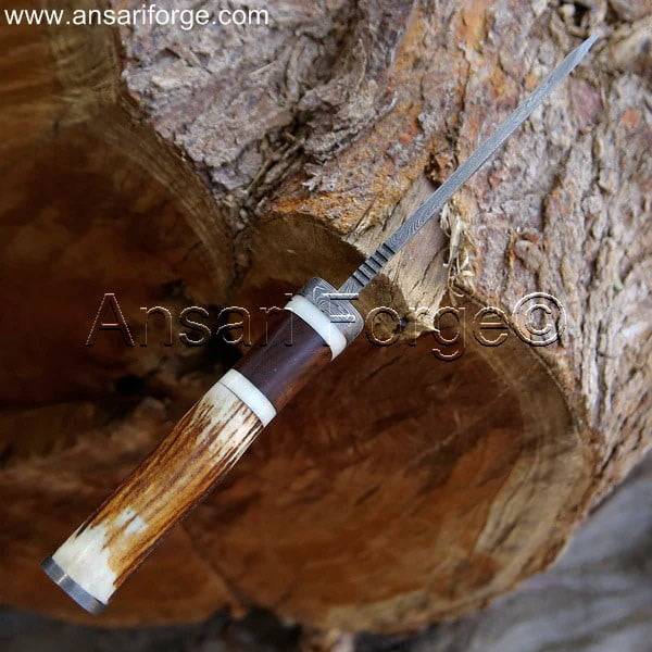 Close-up of Damascus Steel Drop Point Blade.