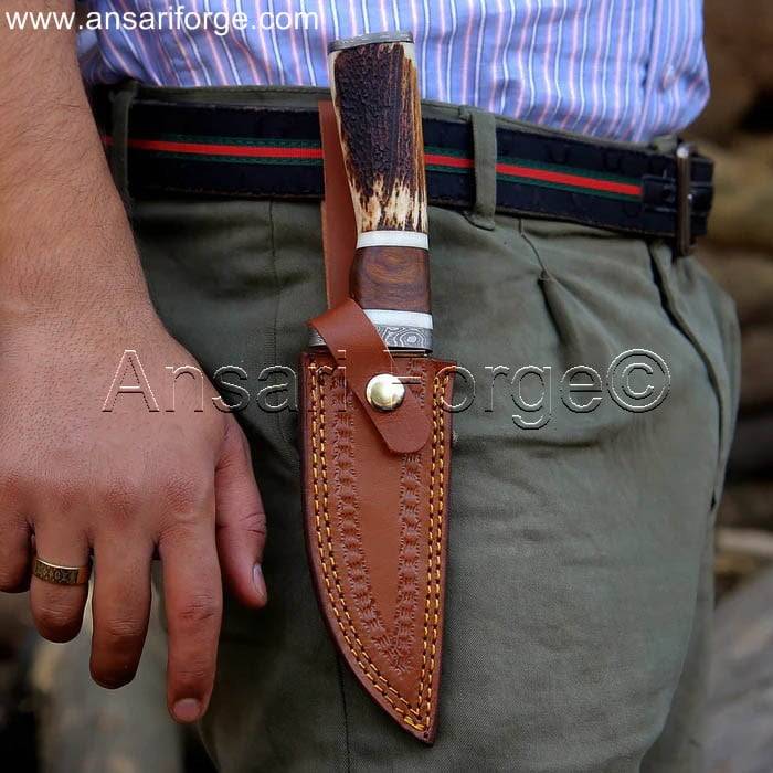 Custom Damascus Hunting Knife with leather sheath by Ansari Forge.