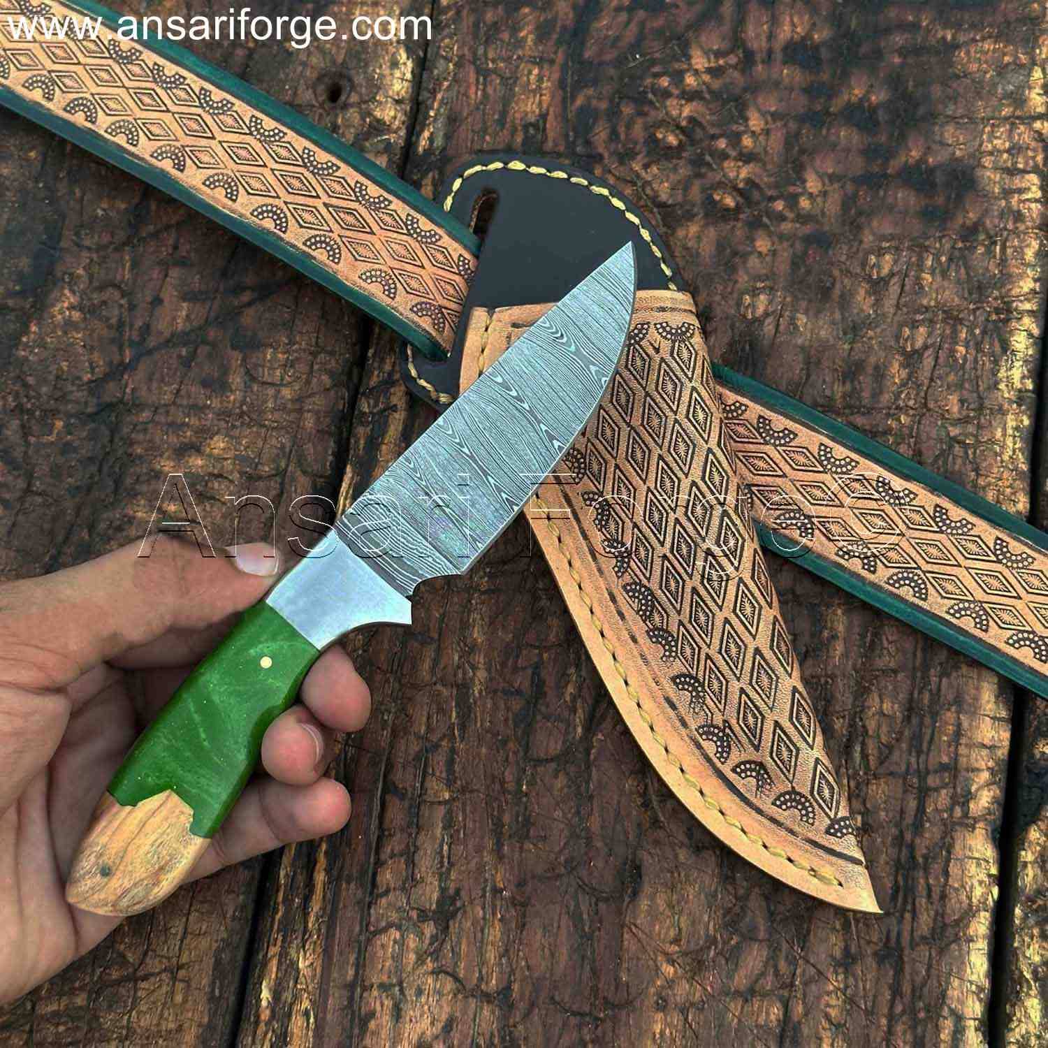 Damascus cowboy belt knife in hand.