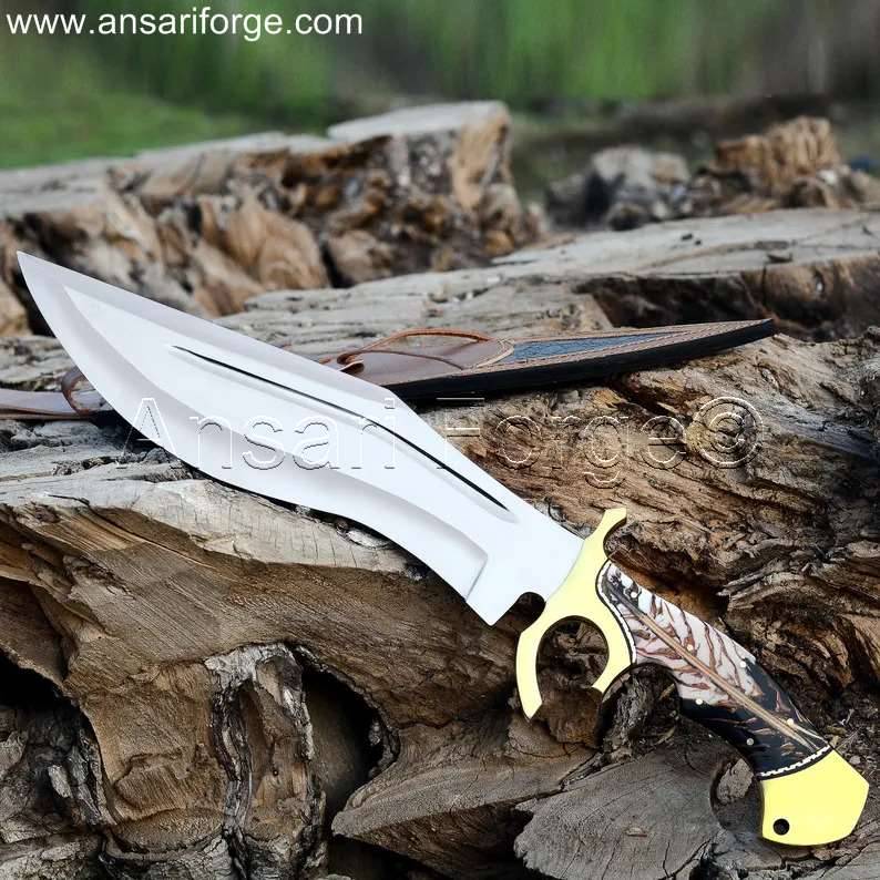 Handmade Custom Bowie Knife by Ansari Forge, featuring a D2 steel blade, resin handle, and leather sheath.