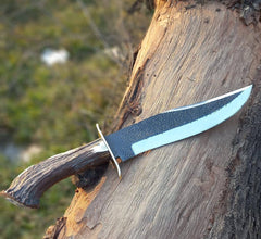 Hand-forged 13-inch Bowie knife with 8-inch clip point blade and stag antler handle.