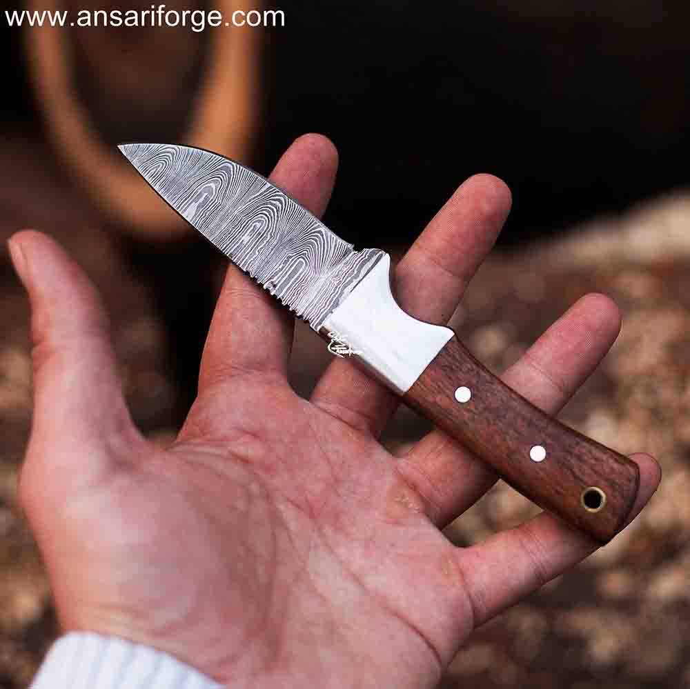 Hephaestus Fixed Blade Knife in Hand, Showcasing Razor-Sharp Edge and Comfortable Grip