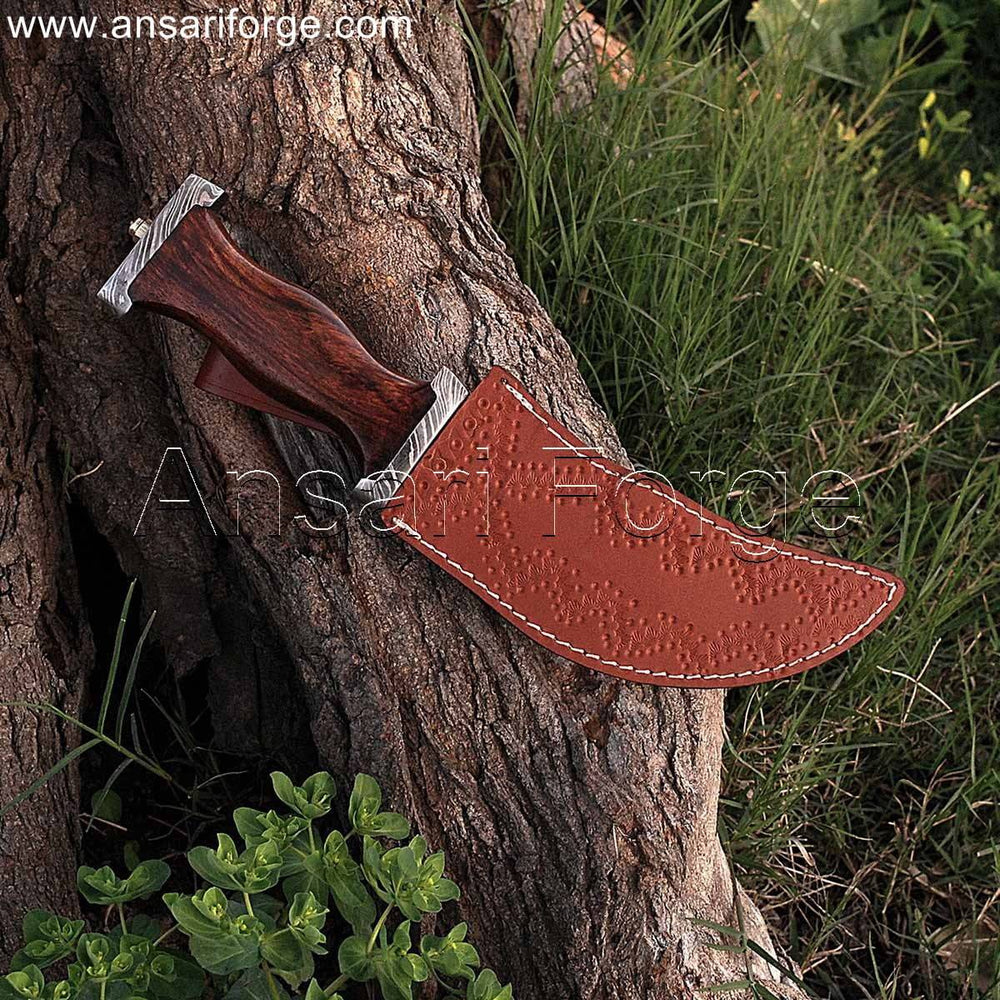 Pirate dagger with curved Damascus blade secured in a genuine cowhide leather sheath.
