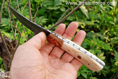Damascus steel hunting knife with leather sheath