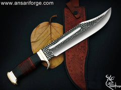 custom-made Crocodile Dundee Bowie Knife. D2 steel blade with hammer forge marks, brass hilt and pommel, and a leather and buffalo horn handle.