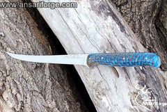A sharp fillet knife with a D2 tool steel blade and a stabilized pine cone handle.