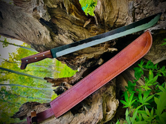 Hand-forged 1095 high carbon steel machete knife with rosewood handle and leather sheath.