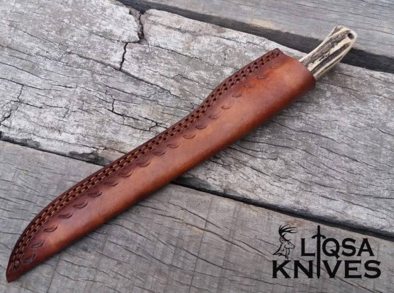 Luxury leather knife sheath included with custom Damascus fillet knife.