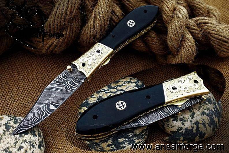 Damascus steel pocket knife buffalo horn handle and leather pouch