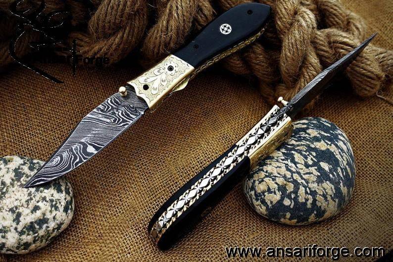 Damascus steel pocket knife buffalo horn handle and leather pouch