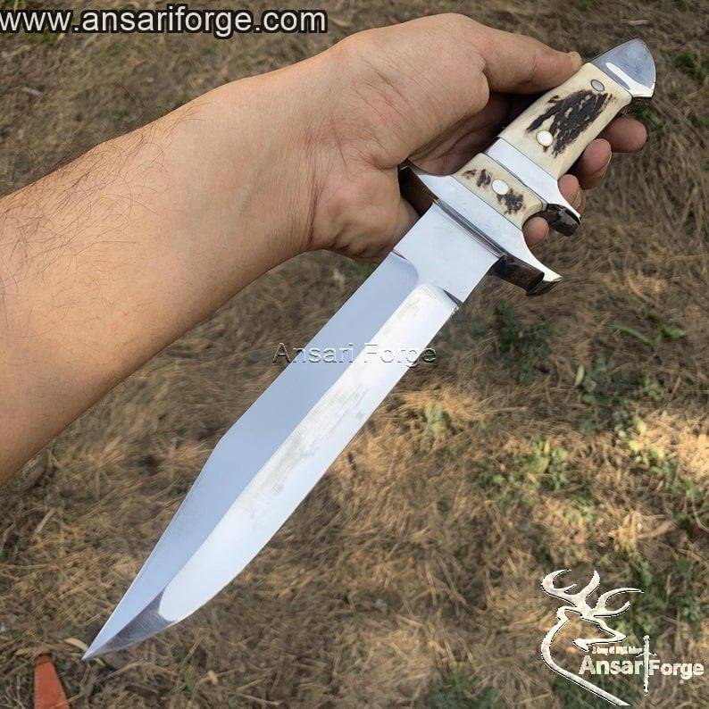 Loveless Knife with hand-forged 440c steel blade, stag antler handle, and genuine cowhide leather sheath by Ansari Forge.