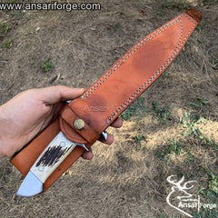 Loveless Knife with hand-forged 440c steel blade, stag antler handle, and genuine cowhide leather sheath by Ansari Forge.