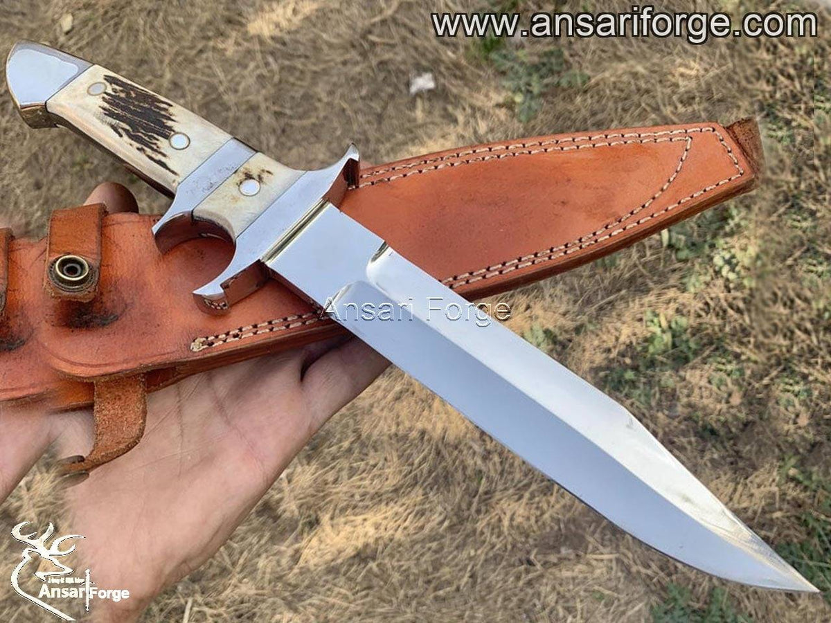 Loveless Knife with hand-forged 440c steel blade, stag antler handle, and genuine cowhide leather sheath by Ansari Forge.