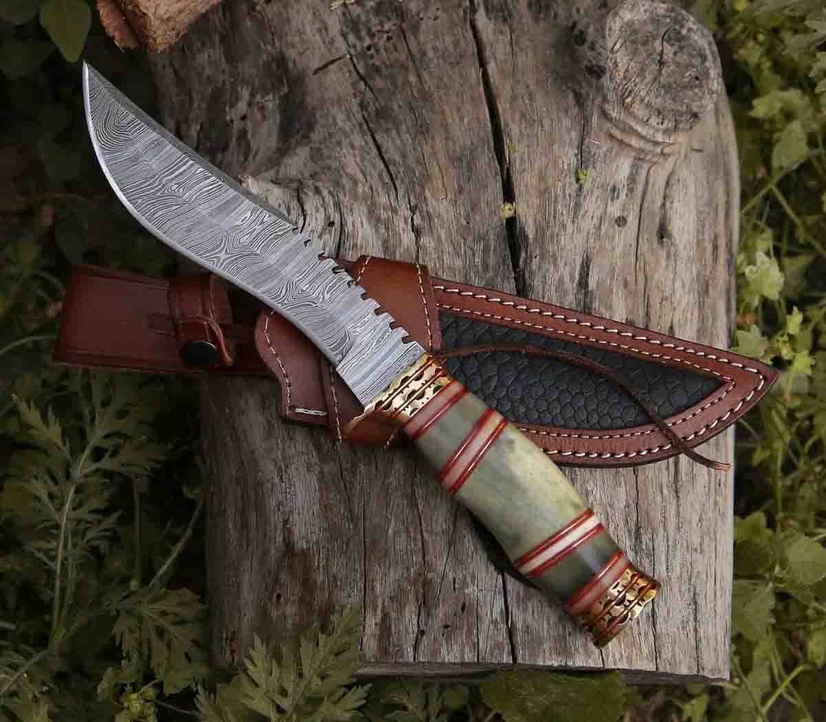 Razor's Edge 13-inch damascus steel hunting knife with bone handle, brass hilt, and leather sheath.