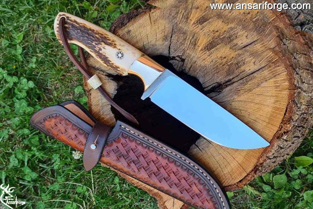 Handmade Fixed Blade Knife with D2 Steel Blade, Stag Antler Handle, Brass Bolsters, and Leather Sheath with Hand-Tooled Artwork.