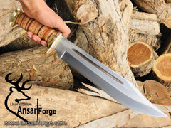 Crocodile Dundee Knife with D2 steel blade, brass hilt and pommel, and leather + buffalo horn handle.