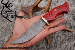 Damascus hunting knife with leather sheath.
