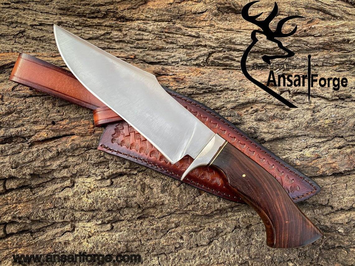 Handmade Hunting Bowie Knife displayed with its genuine cowhide leather sheath, highlighting the knife's elegant design and protective features.