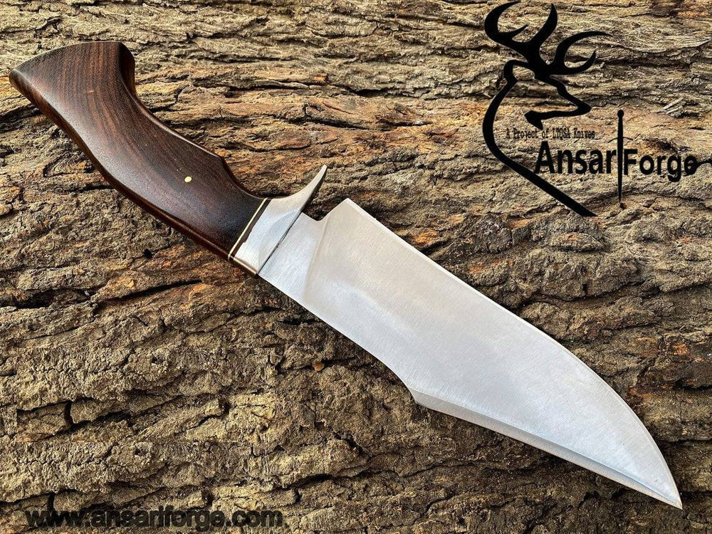 Detailed image of the rosewood handle of the Handmade Hunting Bowie Knife, featuring a stainless steel finger guard.