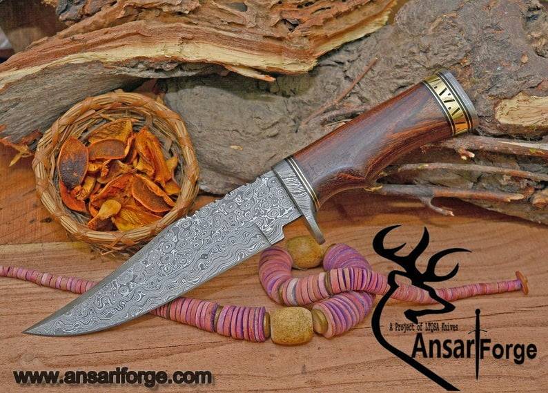 Handmade Damascus Knife with intricate rain drop pattern, walnut wood handle, and Damascus steel guard and pommel.