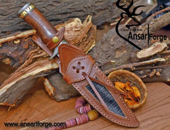 Handmade Damascus knife with a matching cow leather sheath.
