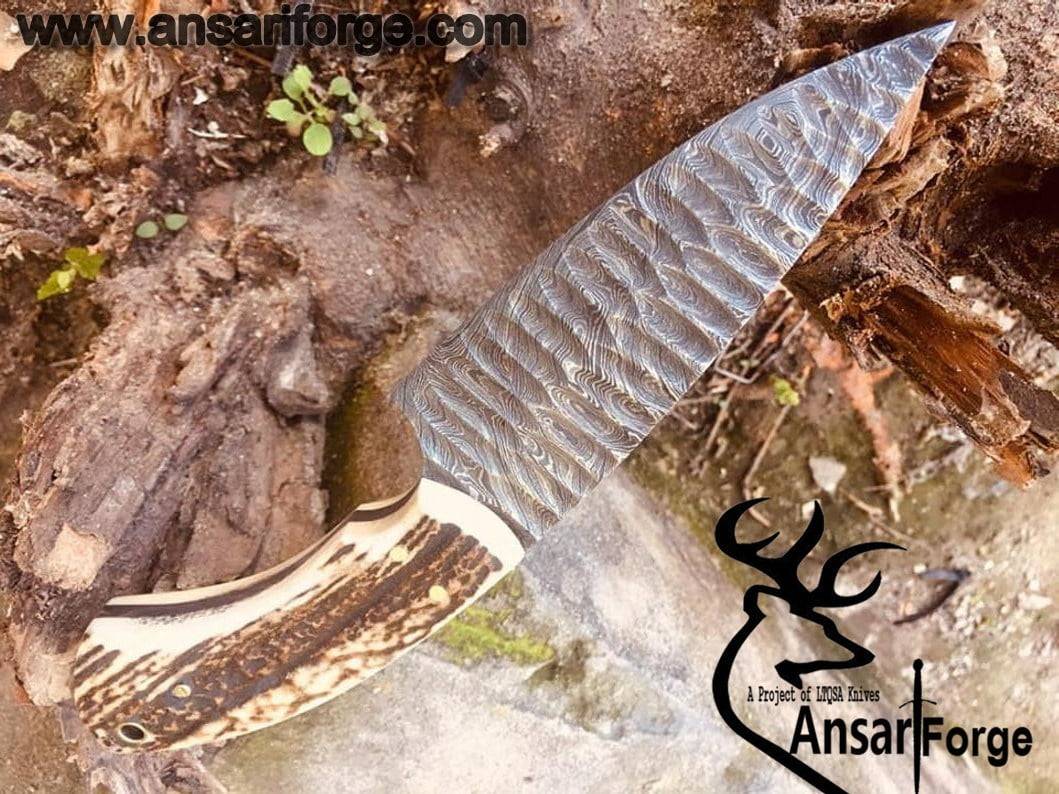 Damascus steel flint knapped hunting knife with stag antler handle