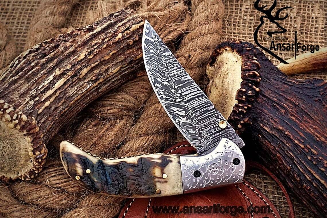 Custom made Damascus steel Pocket knife sheep horn handle