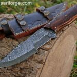 Damascus steel tracker hunting knife.Damascus steel 1095 & 15n20 hand forged twisted blade with 58 - 60 HRC hardness , Rosewood handle and comes with genuine cowhide leather sheath  