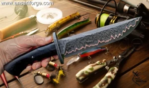 Close-up view of the unique 512-layer copper Damascus knife blade pattern, showing the fusion of 1095 high carbon steel and copper.